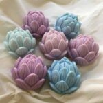 Handmade Lotus Candles with detailed petal designs, crafted from eco-friendly soy wax — perfect for home décor, festive setups, and gifting.