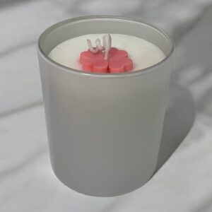 Glossy white scented jar candle with floral wax top by Aesthetic Flames